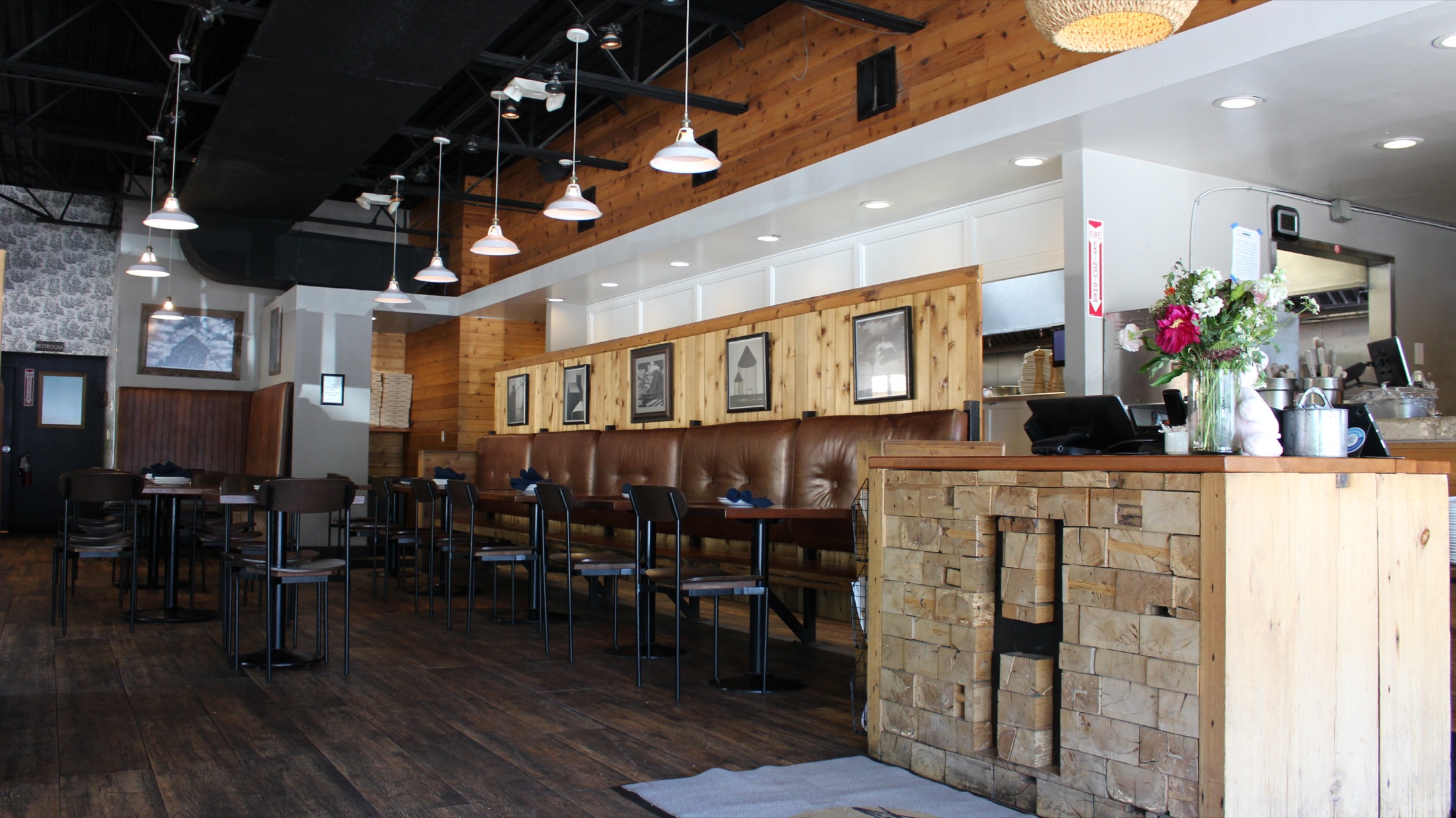 Bexley interior with leather banquette and pendant lighting