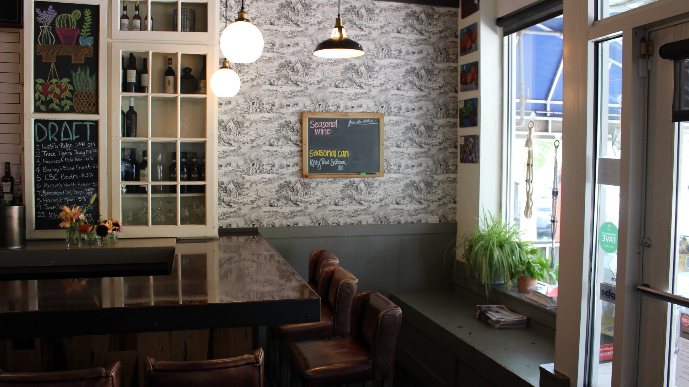 Clintonville bar nook with toile wallpaper and leather chairs