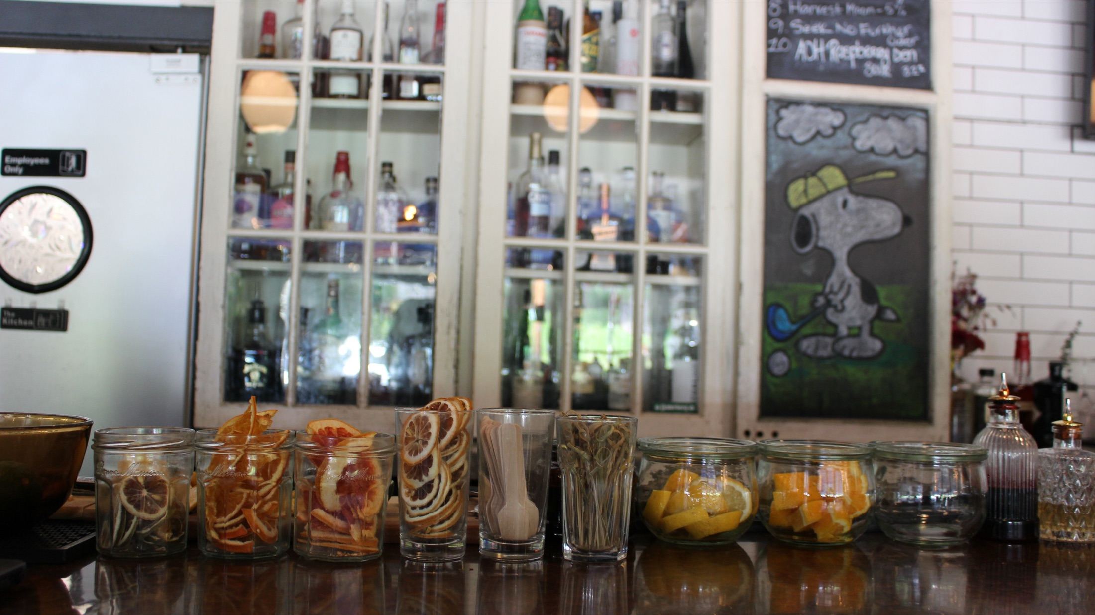 Clintonville bar back with dehydrated citrus garnish jars