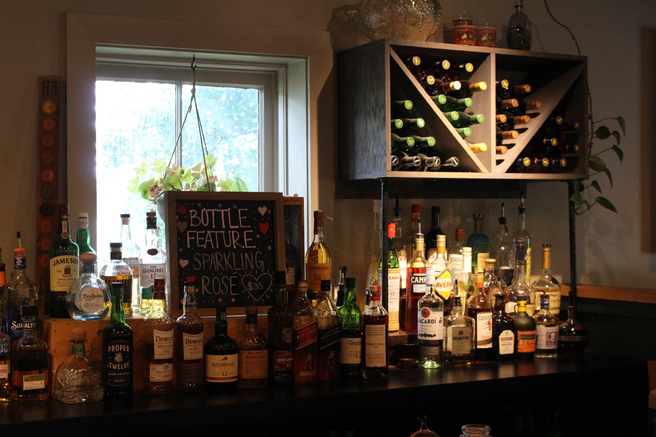 Dublin bar back with Sparkling Rosé bottle feature and wine cubby